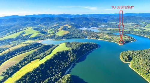 Brama Sanu z prywatną linią brzegową Jeziora Solińskiego pomosty pontony basen sezonowy in Unknown City, Poland