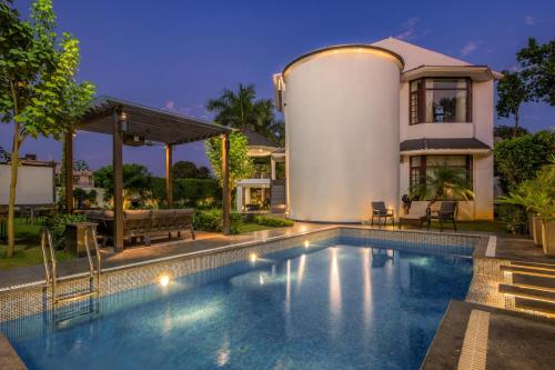 StayVista’s The Secret Lagoon with Outdoor Pool Verdant Lawn & Indoor Outdoor Activities
