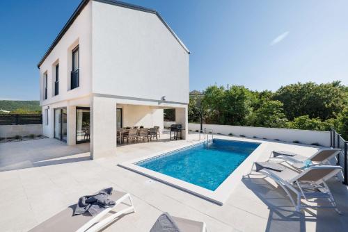 Villa SUNSET II with private pool and beautiful sea view — 4-Star Luxury Hotel in Vrbnik, Croatia