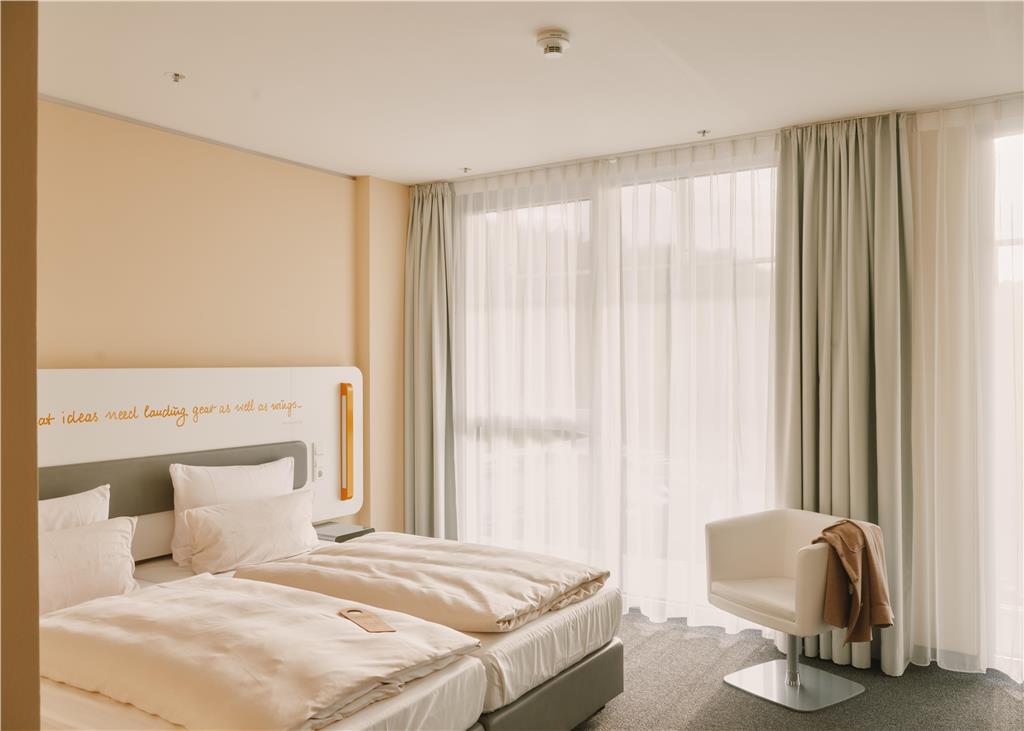 Double room with double bed and club chair