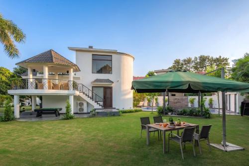StayVista’s The Secret Lagoon with Outdoor Pool Verdant Lawn & Indoor Outdoor Activities