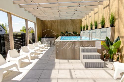 Domki Nord Breeze z podgrzewanym basenem i jacuzzi in Wladyslawowo, Poland