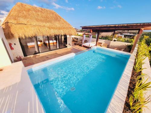 4 Bedroom Deluxe Penthouse with Private Roof Garden With Pool in Aldea Zama Tikal 17 — 4-Star Luxury Hotel in Tulum, Mexico