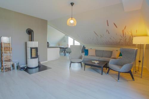 Moderne 5 Sterne Ferienwohnung Meerblick Entspannung am Saaler Bodden — carbon neutral stay, Wustrow