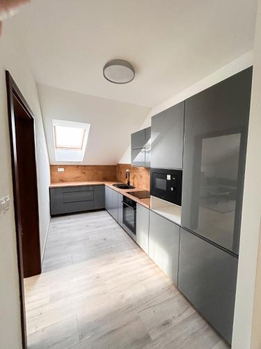 Grey Apartment Hlohovec 21630370 — Hlohovec