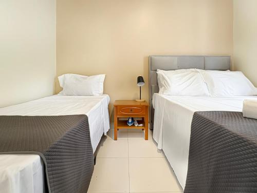 Suite em Pousada com Cozinha Privativa Churrasqueira e Piscina in Guaruja, Brasil