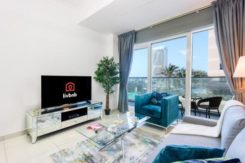 1BR with Balcony Steps from JBR & Marina Walk — 4-Star Luxury Hotel in Dubai, United Arab Emirates