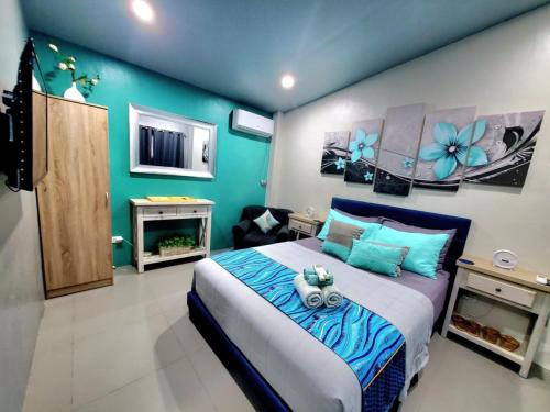 Hidden Palms Inn Deluxe Room in San Juan, Philippines