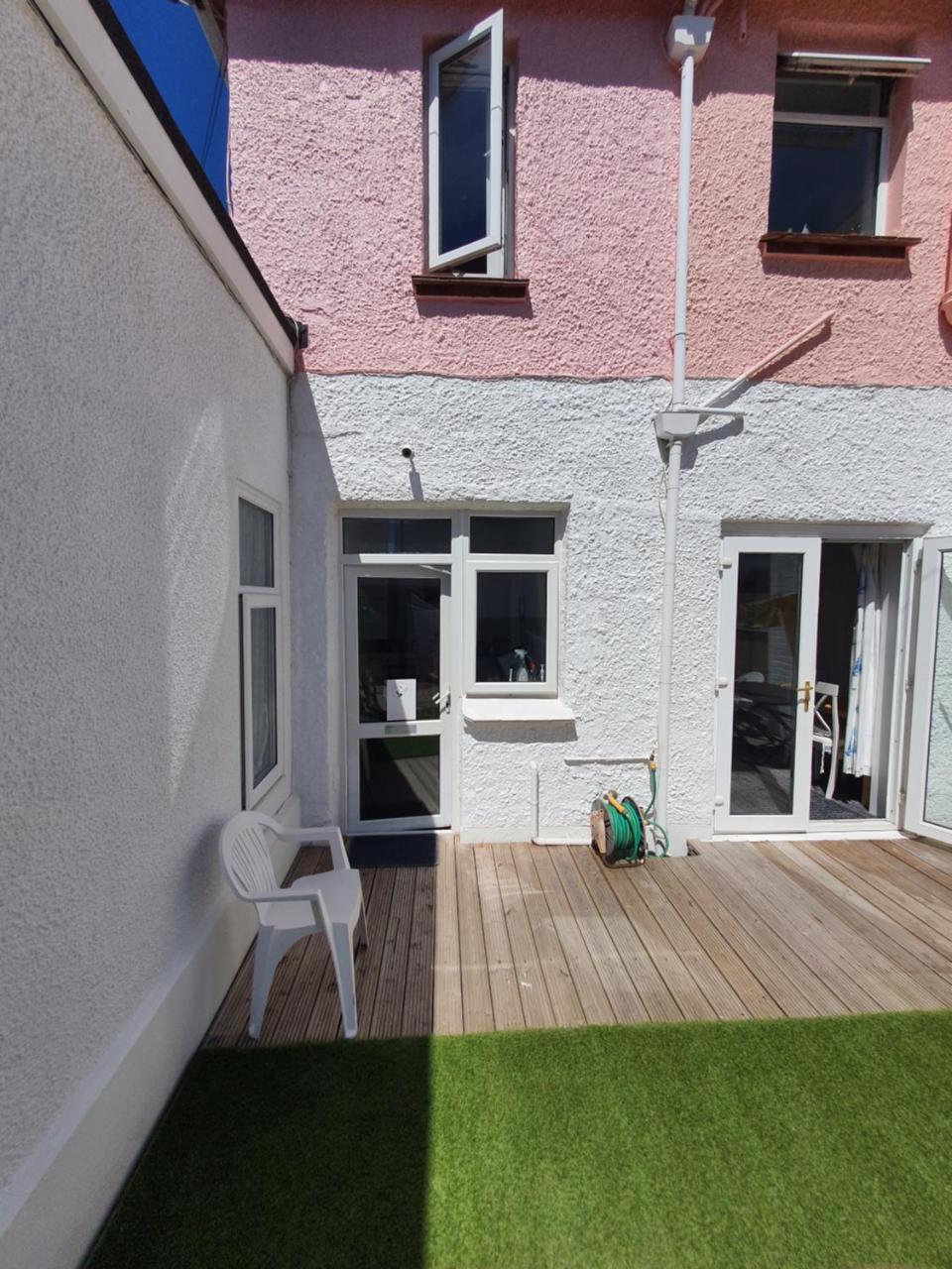 Pink House Opposite Pier & Beach Sleeps 6 2 Bedroom Ground Floor Self Contained Garden Flat Private Entrance Kitchen Guaranteed Parking Wifi Movies Bathroom Fridge Microwave Bedroom 1 Double Bed & 2 Single Beds Bedroom 2 Double Bed — 4-Star Luxury Hotel in Paignton, United Kingdom