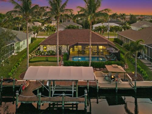 Resort Style House with Canal Heated Pool Games in Cape Coral, United States