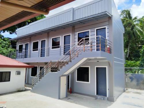 8 Door Room Apartment with Kitchenette and Air Conditioned Individual Room — 4-Star Luxury Hotel in Davao, Philippines