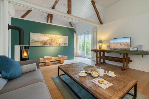 Klüterkammer Ferienhaus auf Gutshof mit Kamin — hotel in Langballig