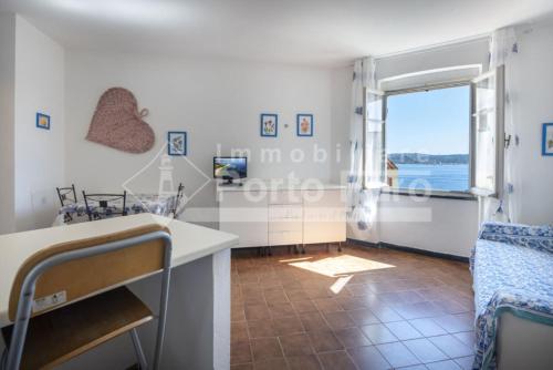 15 FARO Confortevole bilocale sulla spiaggia di Porto Faro — 4-Star Luxury Hotel in Palau, Italy
