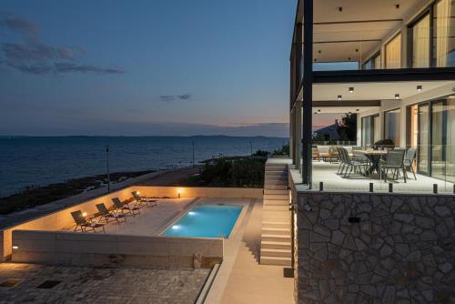 Luxury Seafront Villa Aurea with private Pool Game Room & Stunning Sea Views — 4-Star Luxury Hotel in Privlaka, Croatia