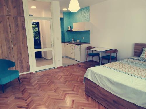 Clock tower apartments - carbon neutral hotel in Podgorica
