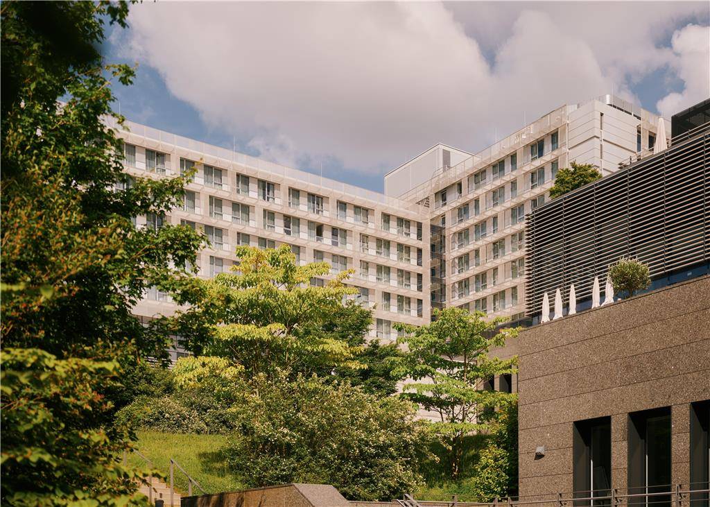 The hotel building is surrounded by nature
