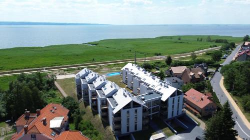 ENKLAWA Apartamenty Piamola z basenem oraz strefą zabaw dla dzieci — 4-Star Luxury Hotel in Krynica Morska, Poland
