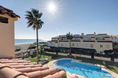 Luxury modern beachfront 3 bed gated community townhouse with pool sun terrace sea views close to all amenities — 4-Star Luxury Hotel in Manilva, Spain
