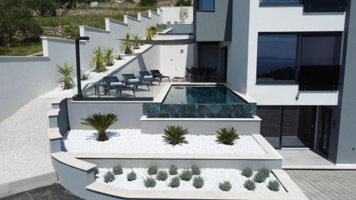 Spectacular villa X with heated pool overlooking Split and sea — 4-Star Luxury Hotel in Podstrana, Croatia