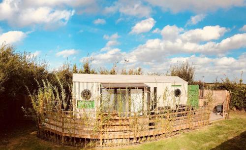 Green CargoPod at Lee Wick Farm Cottages & Glamping in Clacton-On-Sea, United Kingdom