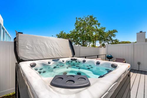 Tidal Tranquility Luxe Beach Stay with Spa Hot Tub Walk to Beach in Cocoa Beach, United States