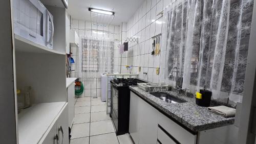 Apto pé na areia em Meia Praia Itapema 3 dormitórios