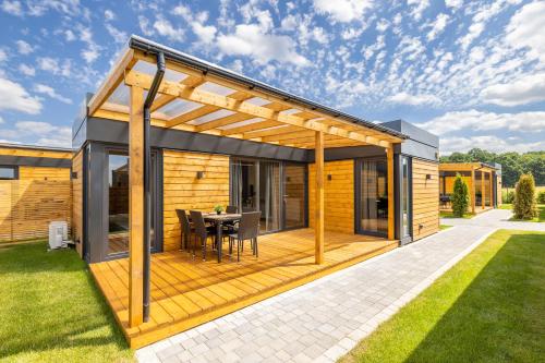 RResort Klimatyzowane domki nad morzem BASEN I SAUNA in Rewal, Poland