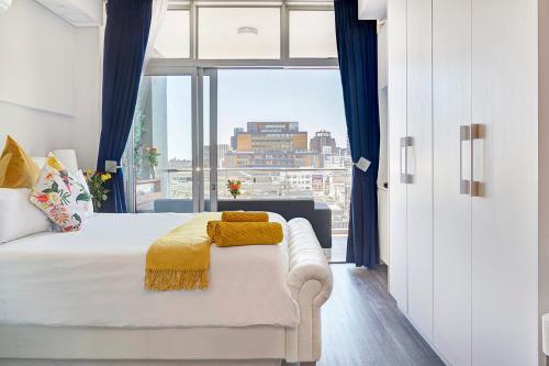 Ruby Designer Apartment with City Mountain Ocean views.
