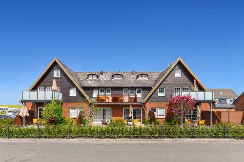Ferienwohnungen Min Huus — 4-Star Luxury Hotel in Neuharlingersiel, Germany