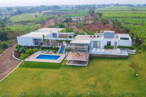 Open House by StayVista Nestled in nature featuring a Swimming pool & Expansive lawn for a serene retreat