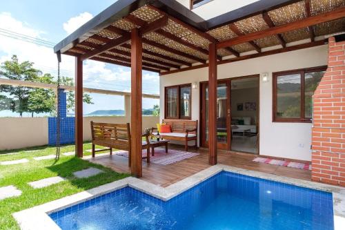 Safira Linda c 3 suites frente mar piscina churr garagem Netflix e Wi Fi in Paraty, Brasil