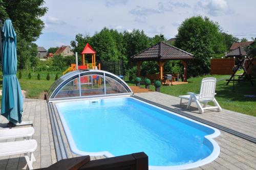 Domek Bagienice z basenem in Mragowo, Poland