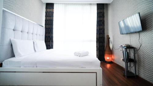 Stunning and Cozy 1BR at The Via and The Vue Apartment By Travelio — 4-Star Luxury Hotel in Surabaya, Indonesia