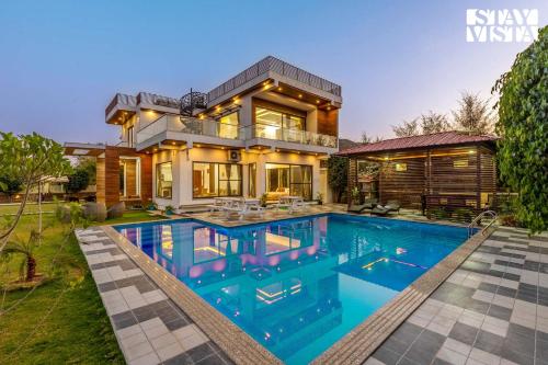 StayVista's Bella Dream Mountain View with Outdoor Pool Lawn featuring a Gazebo & Indoor Games — 4-Star Luxury Hotel in Udaipur, India