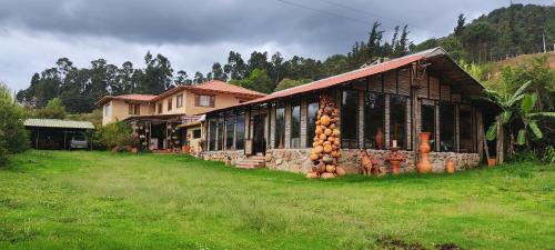 Risgua - carbon neutral hotel in Tinjaca
