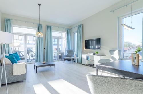 Käptenslounge Ferienapartment für vier Personen mit Westbalkon und komfortabler Ausstattung — 4-Star Luxury Hotel in Wustrow, Germany