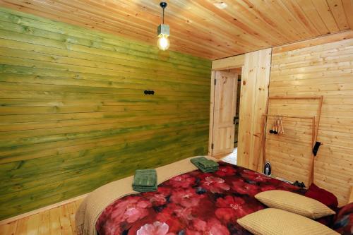 Wooden cottage green house in Bakuriani