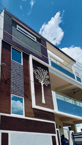 TrueLife Chinmai Nivas Breakfast Included Modern 2BHK homes for families Tirumala Mountain View Fast WiFi Many restaurants nearby Hall AC bedrooms Modular Kitchen Android TV 250 Jio Channels Top Service with lots of Love — 5-Star Luxury Hotel in Tirupati, India