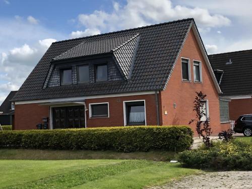 Ferienwohnung Wattwurm — 4-Star Luxury Hotel in Neuharlingersiel, Germany