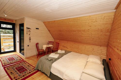 Wooden cottage green house in Bakuriani