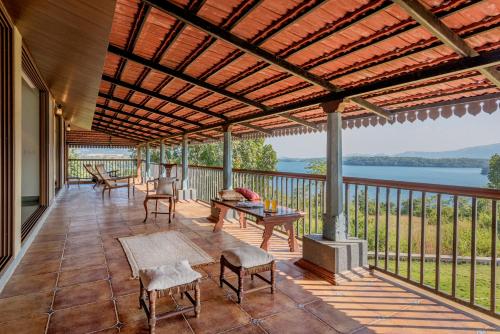 SaffronStays Anantham 3BR Pet Friendly Kerala Style Lakefront Villa with Verandah & Views — 4-Star Luxury Hotel in Pune, India