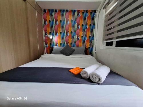 Homey 1BR With Balcony City View in Grace Res in Taguig, Philippines