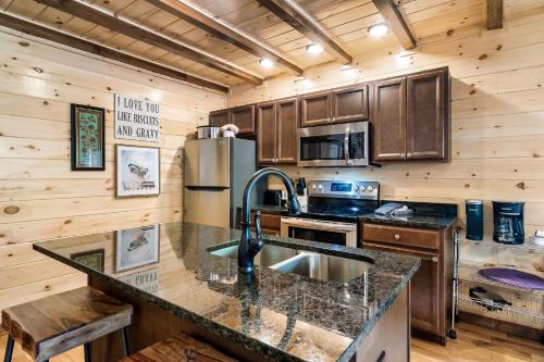 SmokiesBoutiqueCabins would love to host you at Dolly’s Cute Cabin 4 Suites with Private Bathrooms Hot Tub Fire Pit Game Room Resort Pool open Memorial Day through Labor Day in Gatlinburg, United States