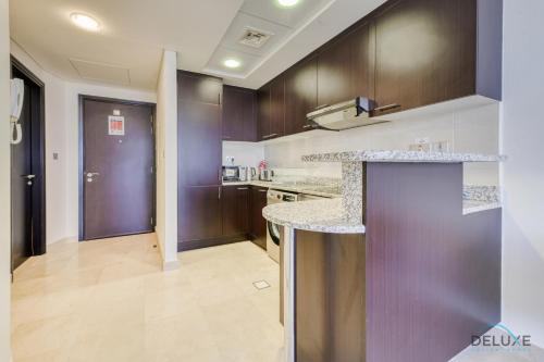 Affordable Luxury Modern 1BR with Pool & Balcony by Deluxe Holiday Homes — 4-Star Luxury Hotel in Dubai, United Arab Emirates