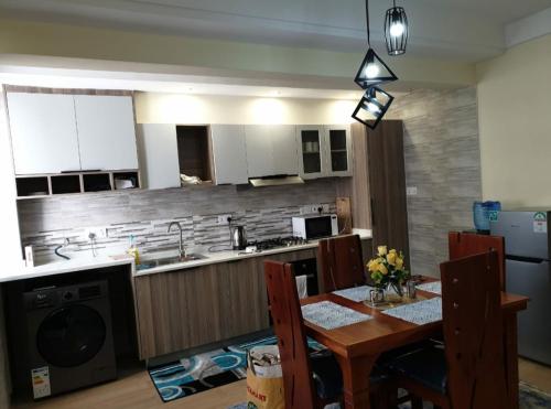 Elegant classy apartment with modern equipped gym private parking space and proximity to major shopping malls