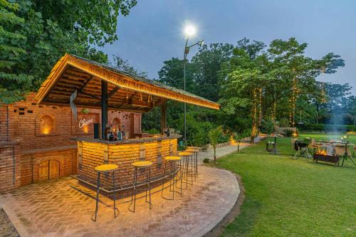 StayVista at Peacocks & Partridges with Amidst Greenery Terrace Indoor Fireplace Bar & Snooker Table