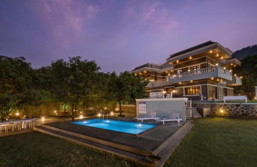 SaffronStays Peshwaai 5BR Karjat villa with lawn pool & terrace plunge mezzanine family rooms near Songiri & Kondhana — 4-Star Luxury Hotel in Karjat, India