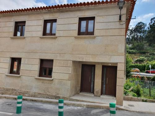 Casas Fontan - carbon neutral hotel in Combarro