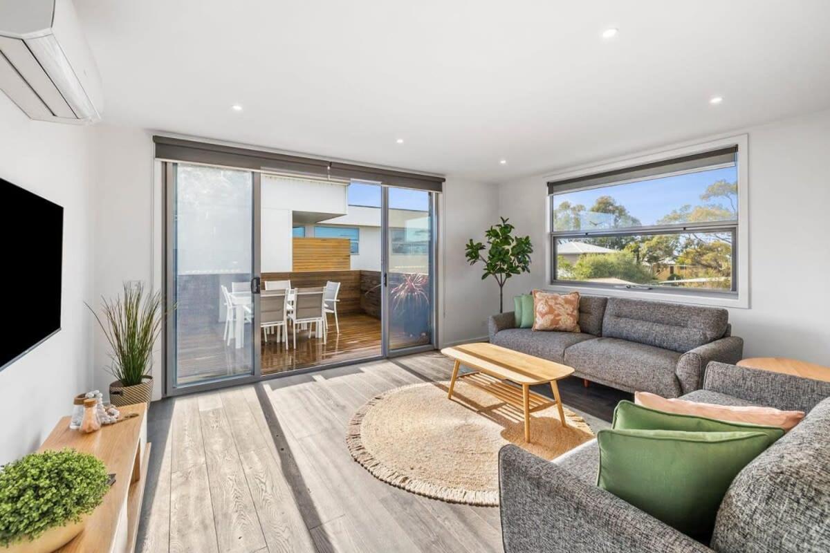 A wave from it all ocean glimpse central Torquay in Torquay, Australia