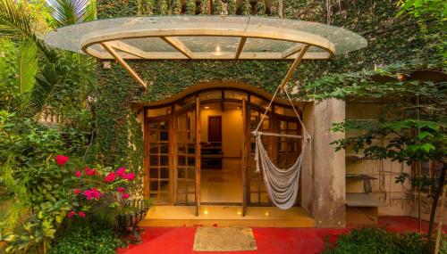 SaffronStays Birdsong 3BR pet friendly villa with lawns treetop terraces gazebo dining & tennis court